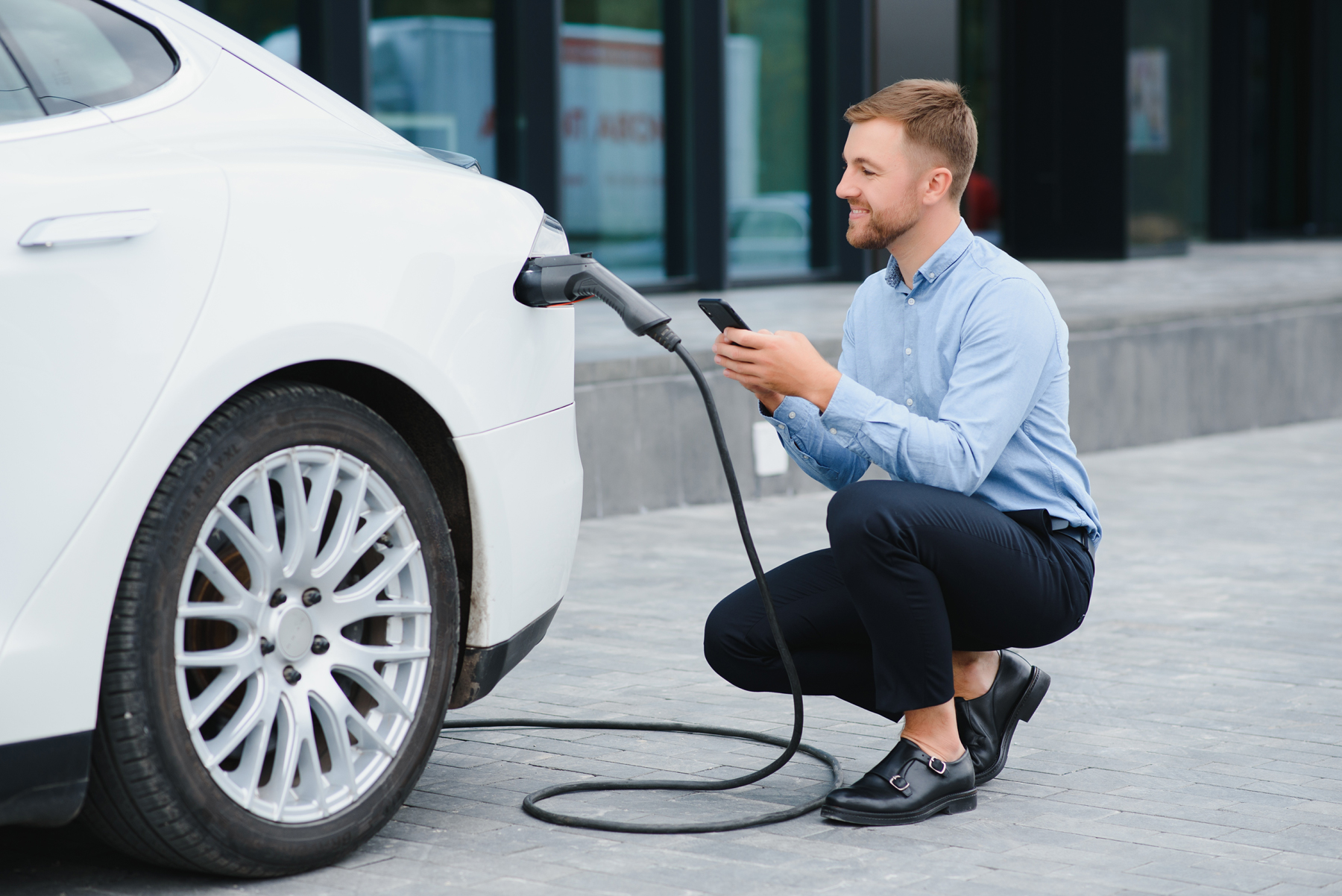 Guy charging ev